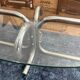 Oval glass coffee table with chrome legs, vintage 70s design.