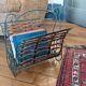 Metal and woven rattan magazine rack from the 60s.