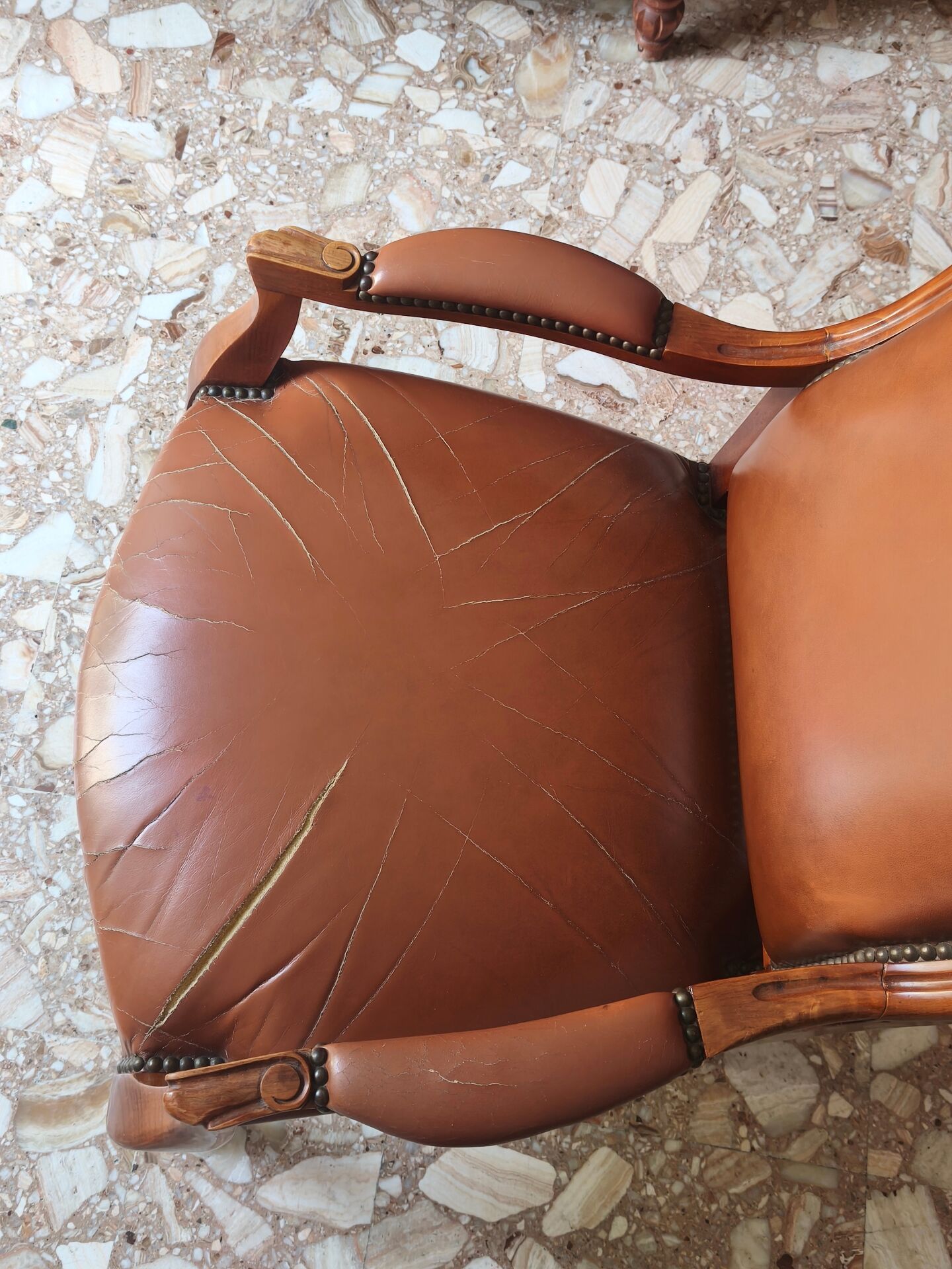 Leather armchair signed