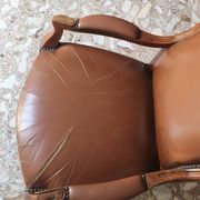 Leather armchair signed