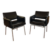Pair of vintage armchairs in black faux leather and chrome metal.