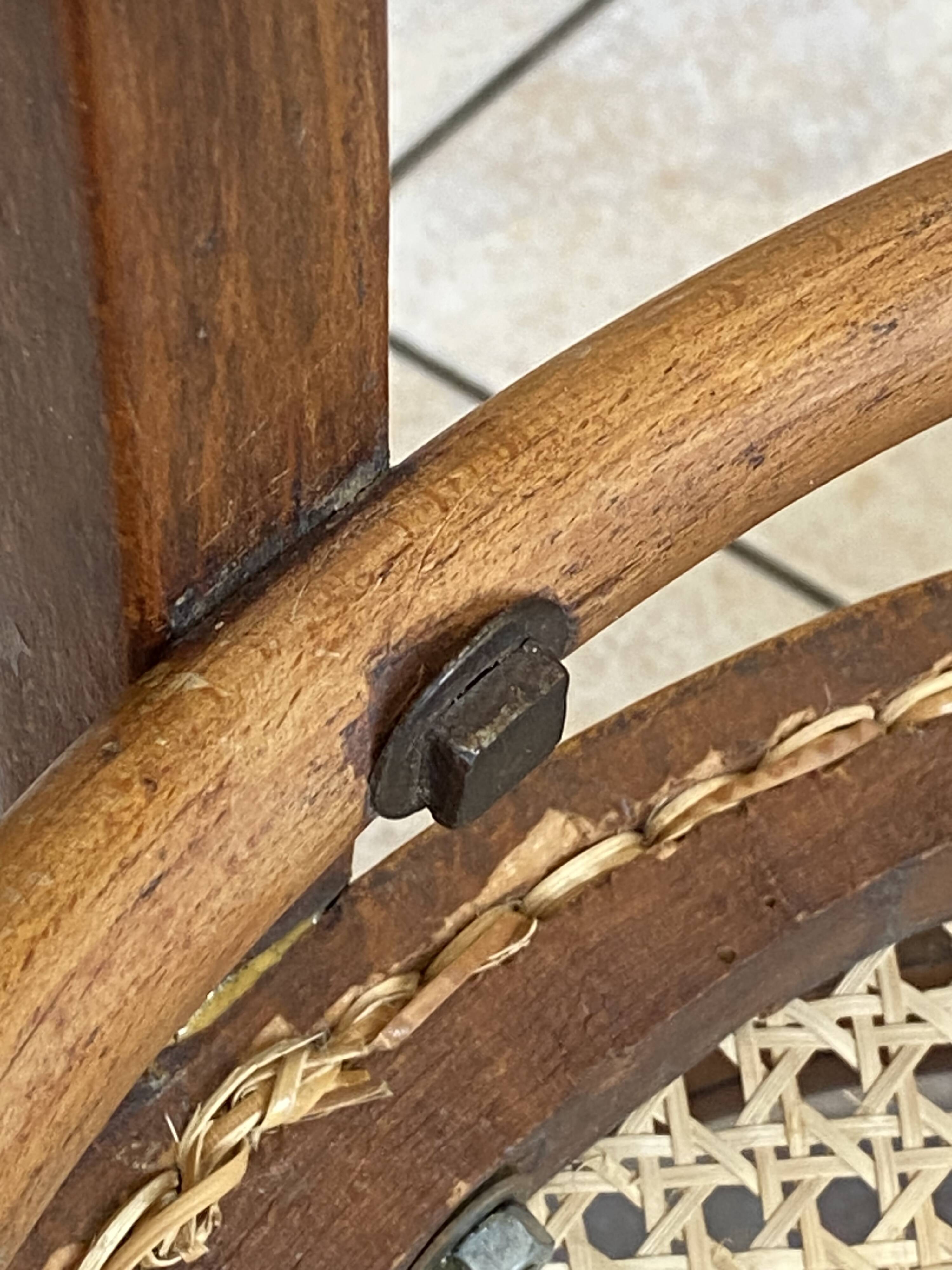 Bistro chair with a curved wooden frame and caned seat from the 1930s.