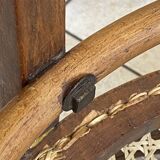 Bistro chair with a curved wooden frame and caned seat from the 1930s.