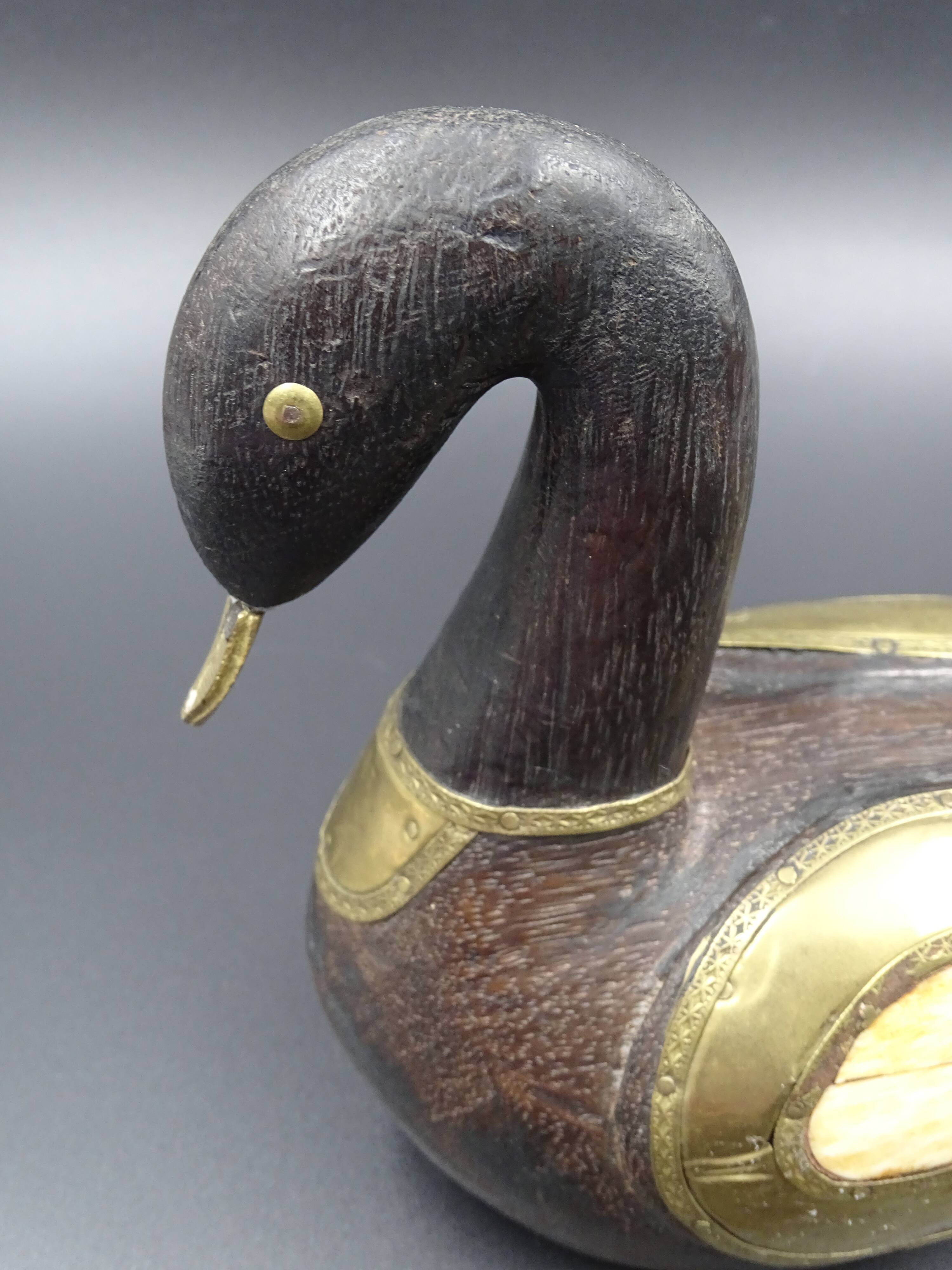 Wooden and brass swan