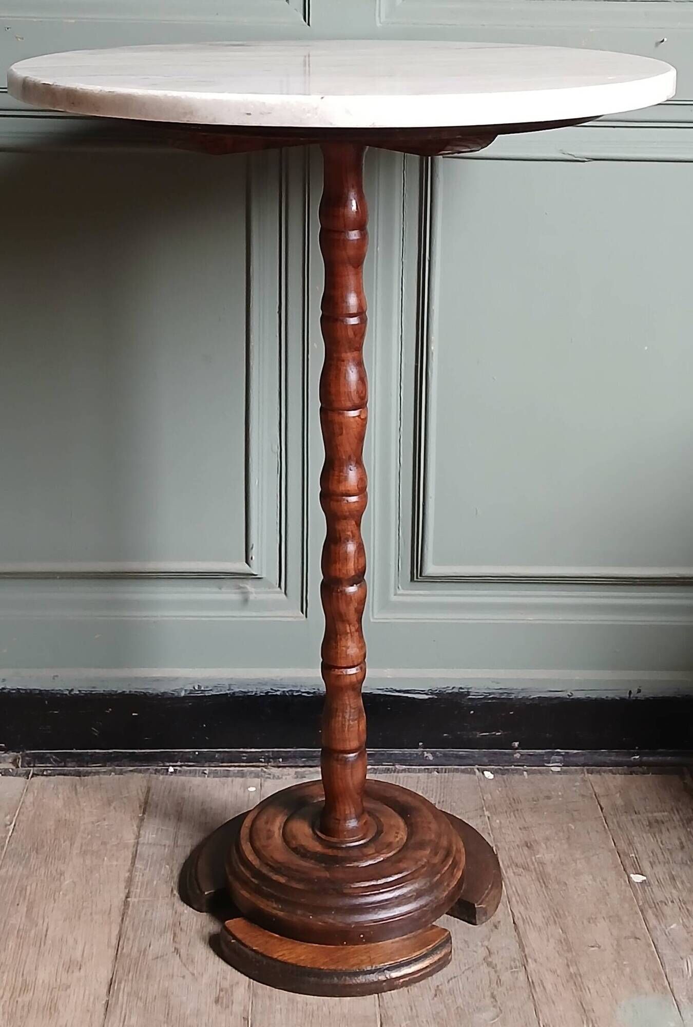 Turned solid wood side table stained with a quartz top.