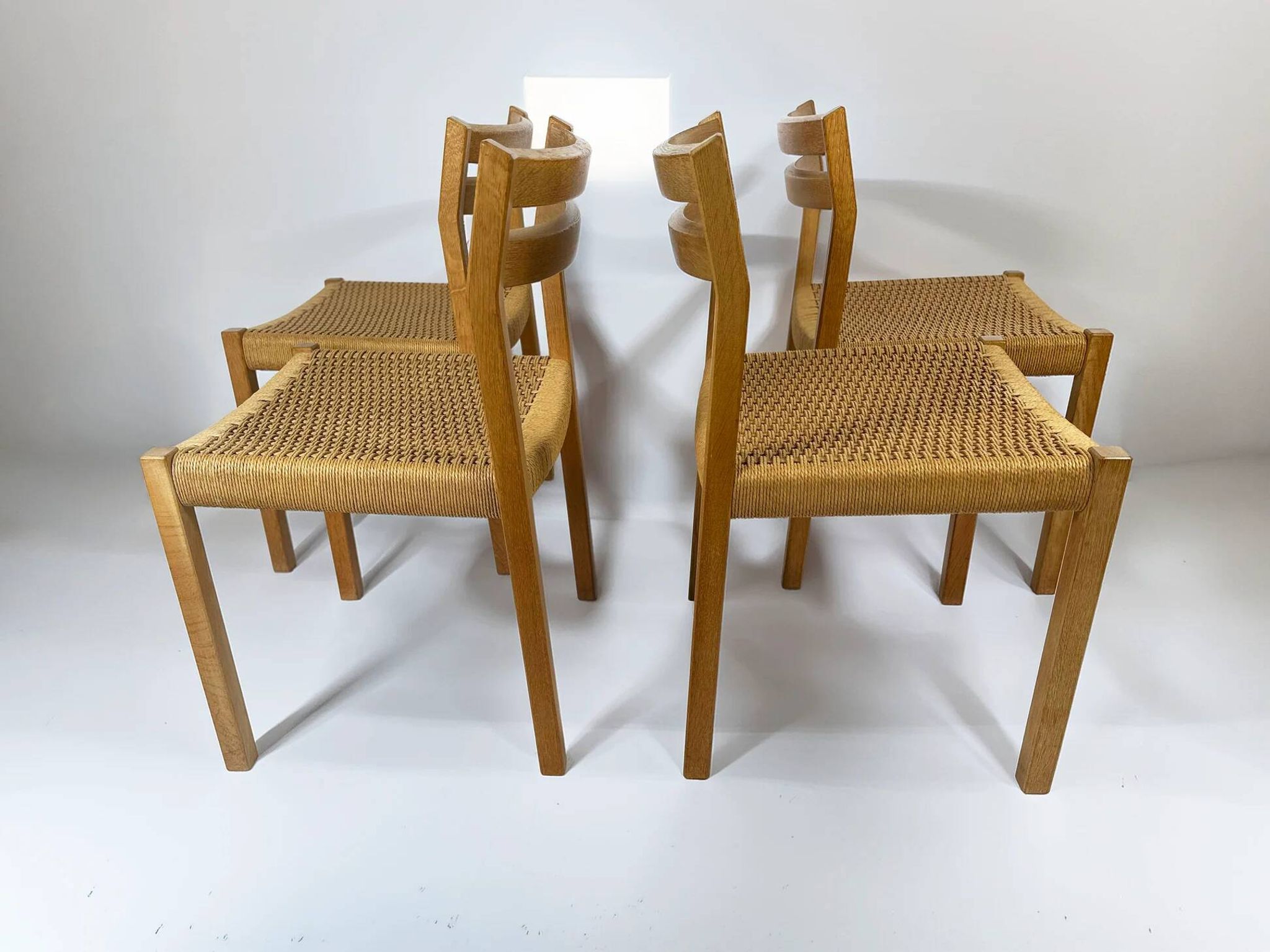 Dining chairs J.H. Møller model 401 in oak with original Danish cord — Denmark, 1970s