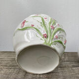 White ceramic pot cache in old flower slip