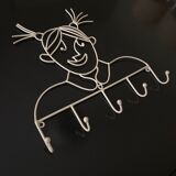 Pair of iron coat holders girl and boy