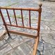Child's bed or vintage rest bed made of solid cherry wood in a bamboo style.