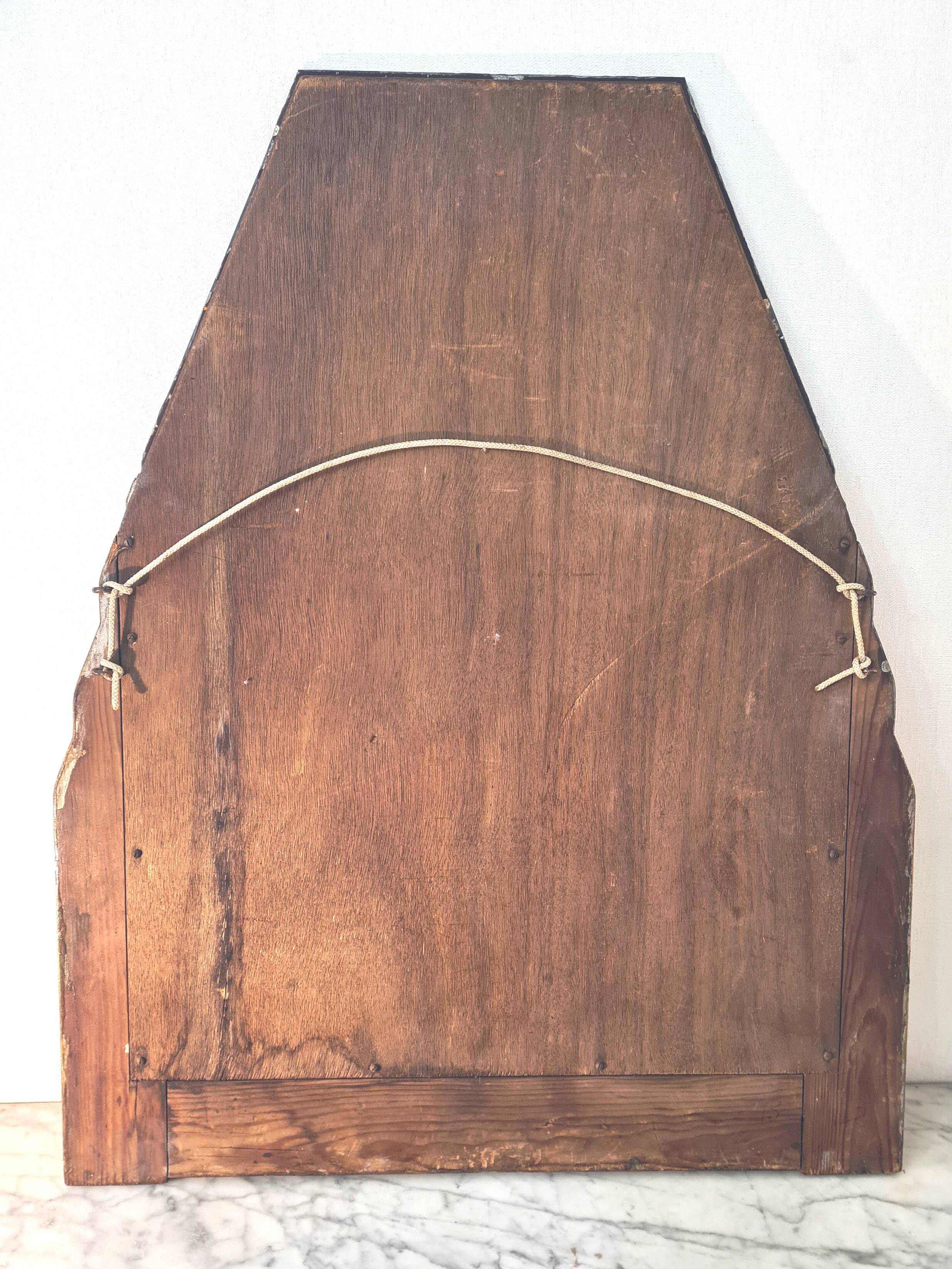 Antique Art Deco mercury mirror, in carved wood with gold leaf.
