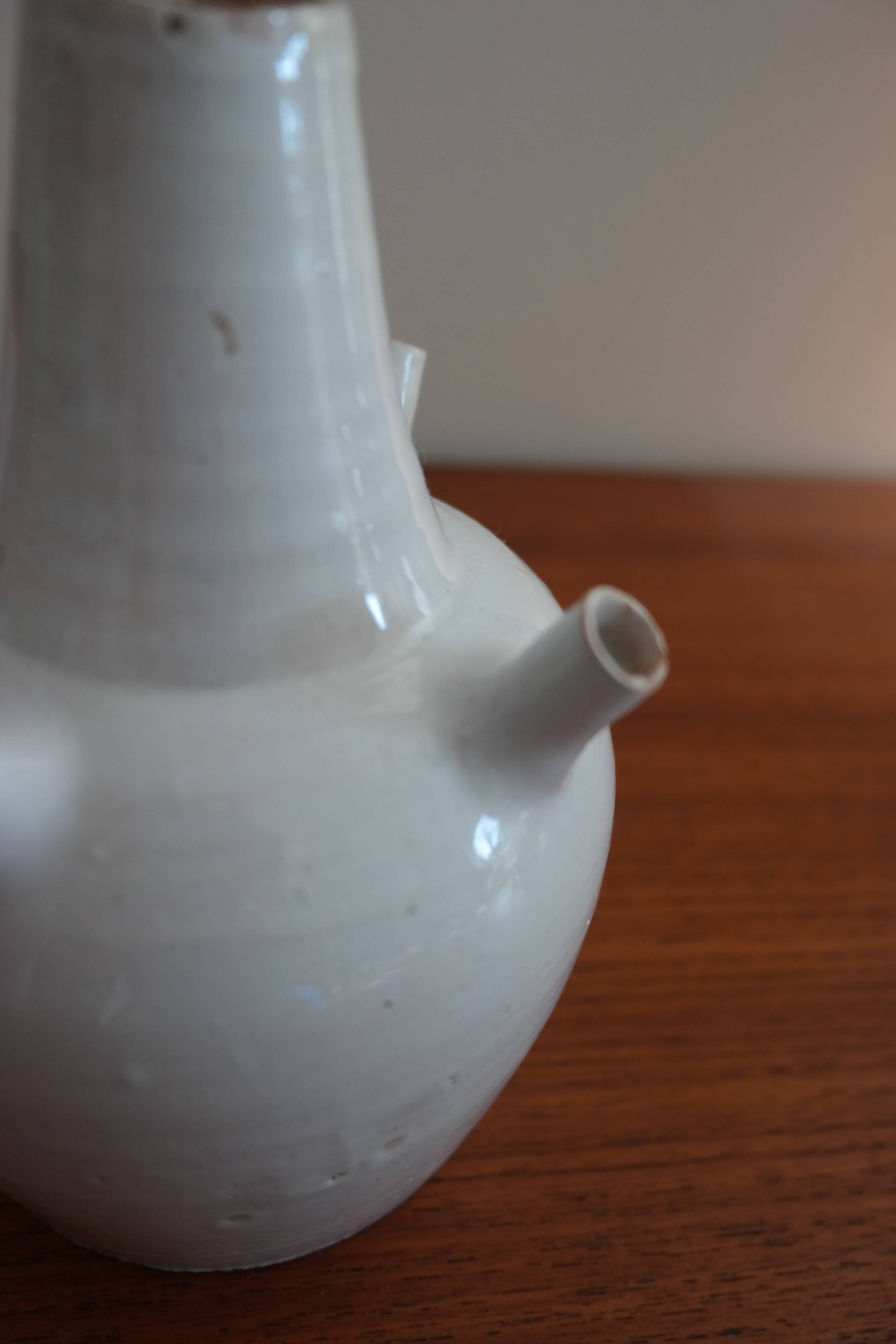 White enamelled earthenware flower vase signed HR