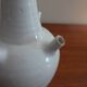 White enamelled earthenware flower vase signed HR