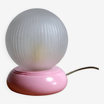 Pink table lamp and glass globe