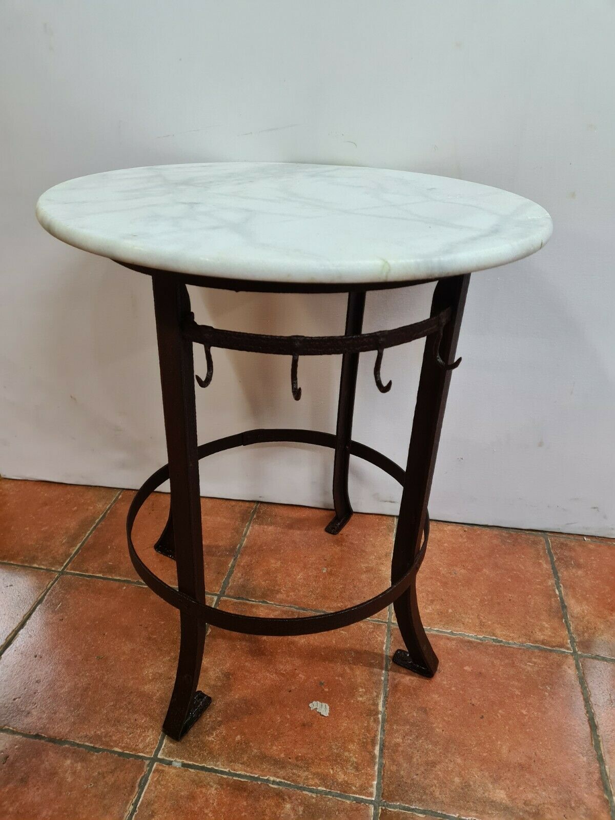 Iron pedestal table and marble top