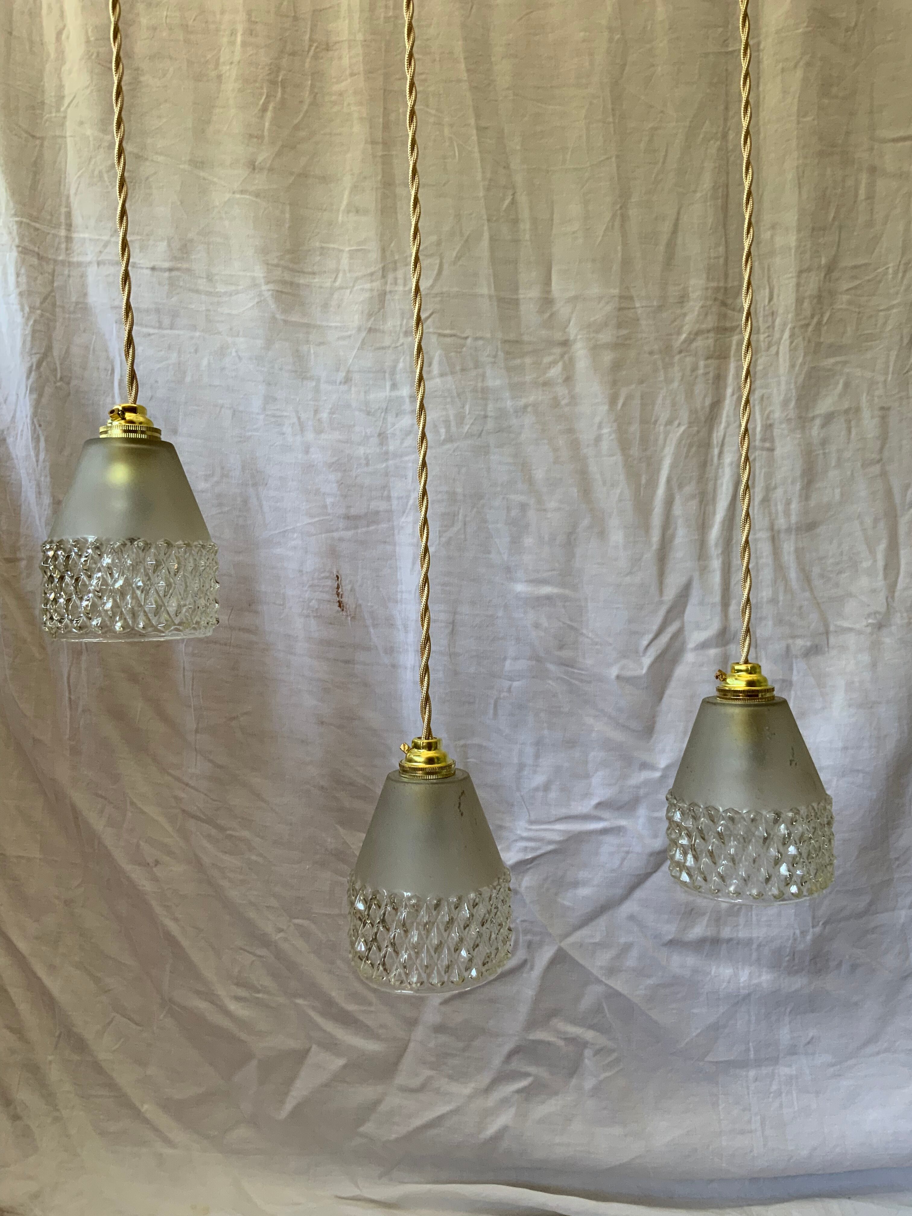 Trio of vintage suspensions