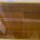 Regency style console table, in gilded metal and smoked glass