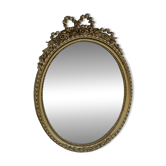 Oval mirror with a pediment in Louis XVI style – reproduction from the 19th century.