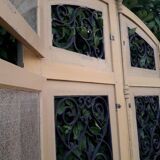 Porte d'entrée cintrée double en chêne, grilles et verre, XIXème