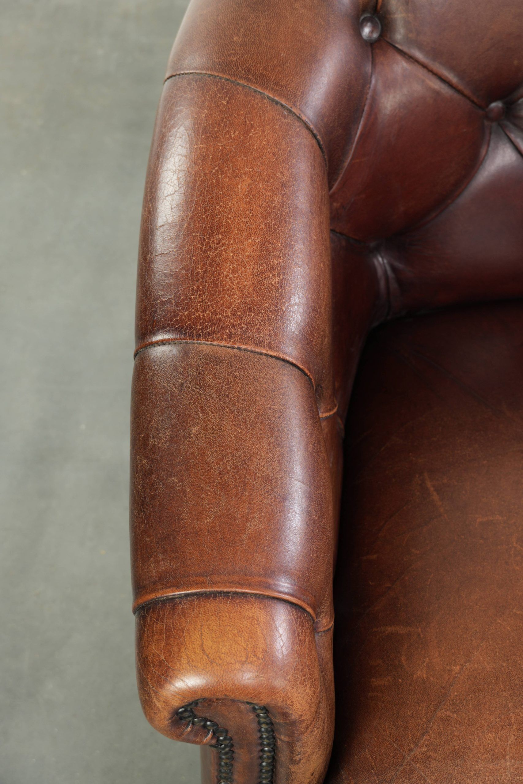 Characterful set of sheepskin club armchairs in English chesterfield style