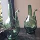 Pair of blown glass wine decanters in blue/green hues.