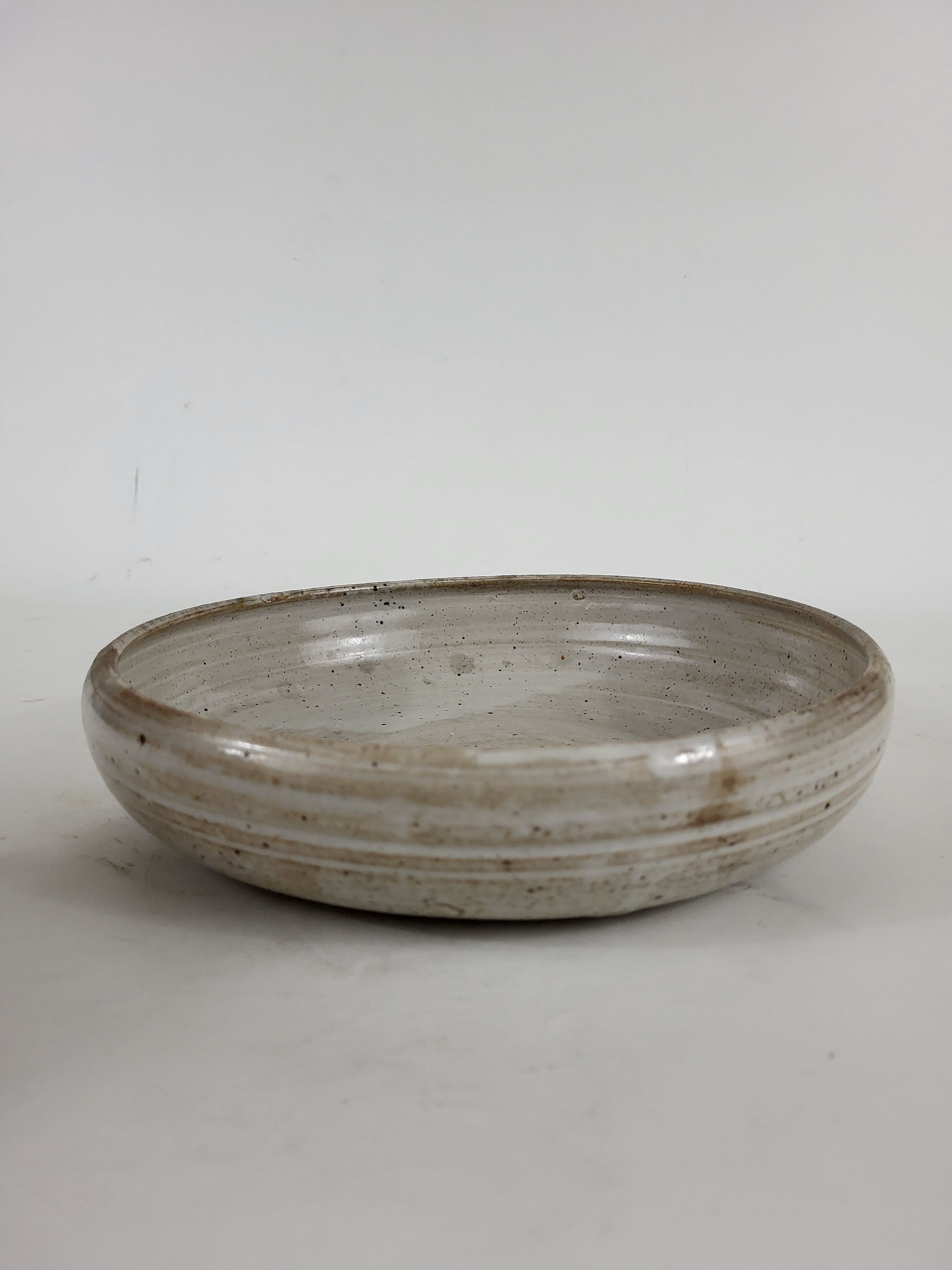 Hollow stoneware dish signed Pierre lion Puisaye