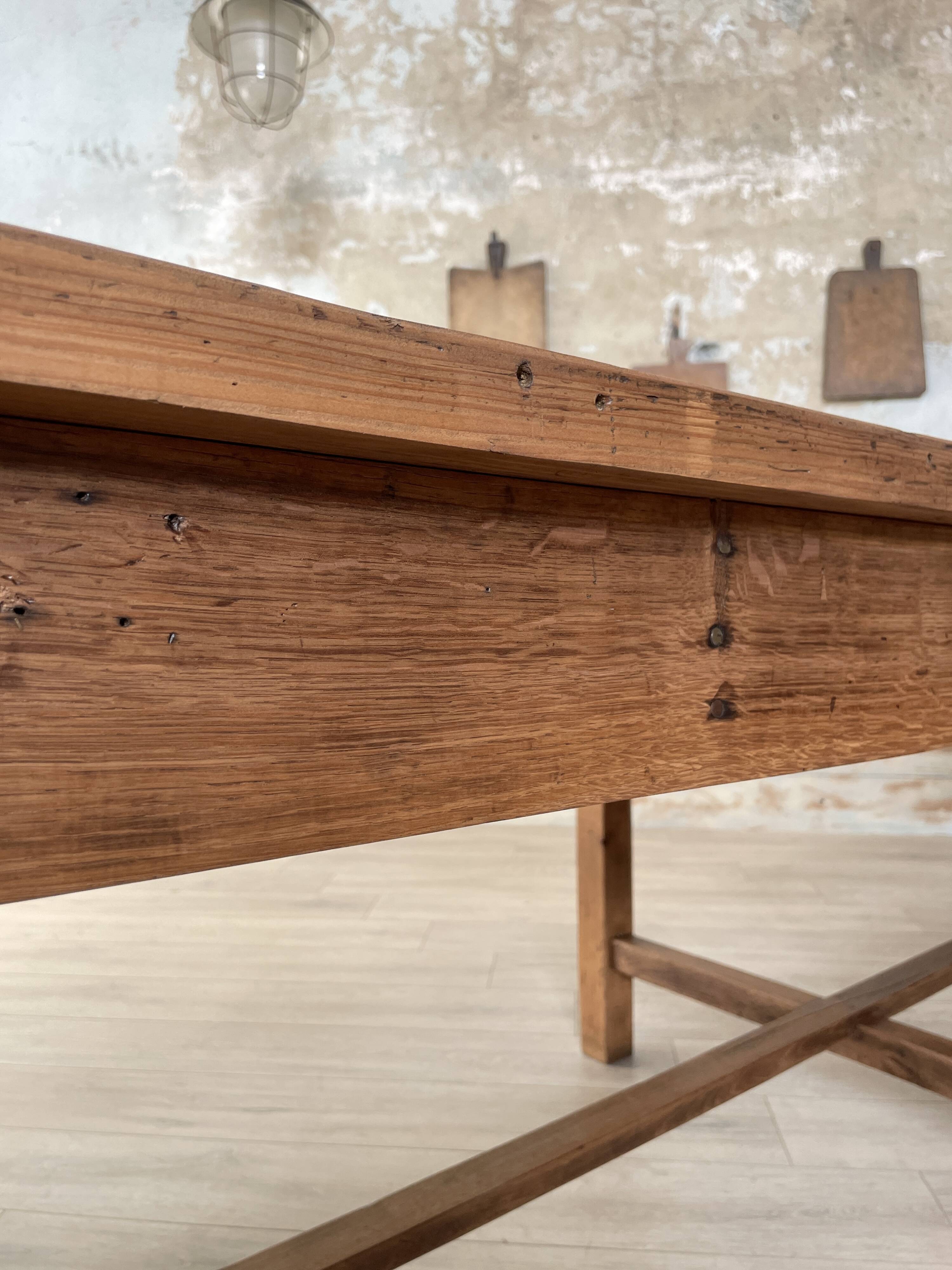 Solid wood workshop table with straight legs.