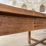 Solid wood workshop table with straight legs.