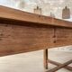 Solid wood workshop table with straight legs.