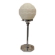 Chrome metal lamp with glass globe, Art Deco style, 20th century period.