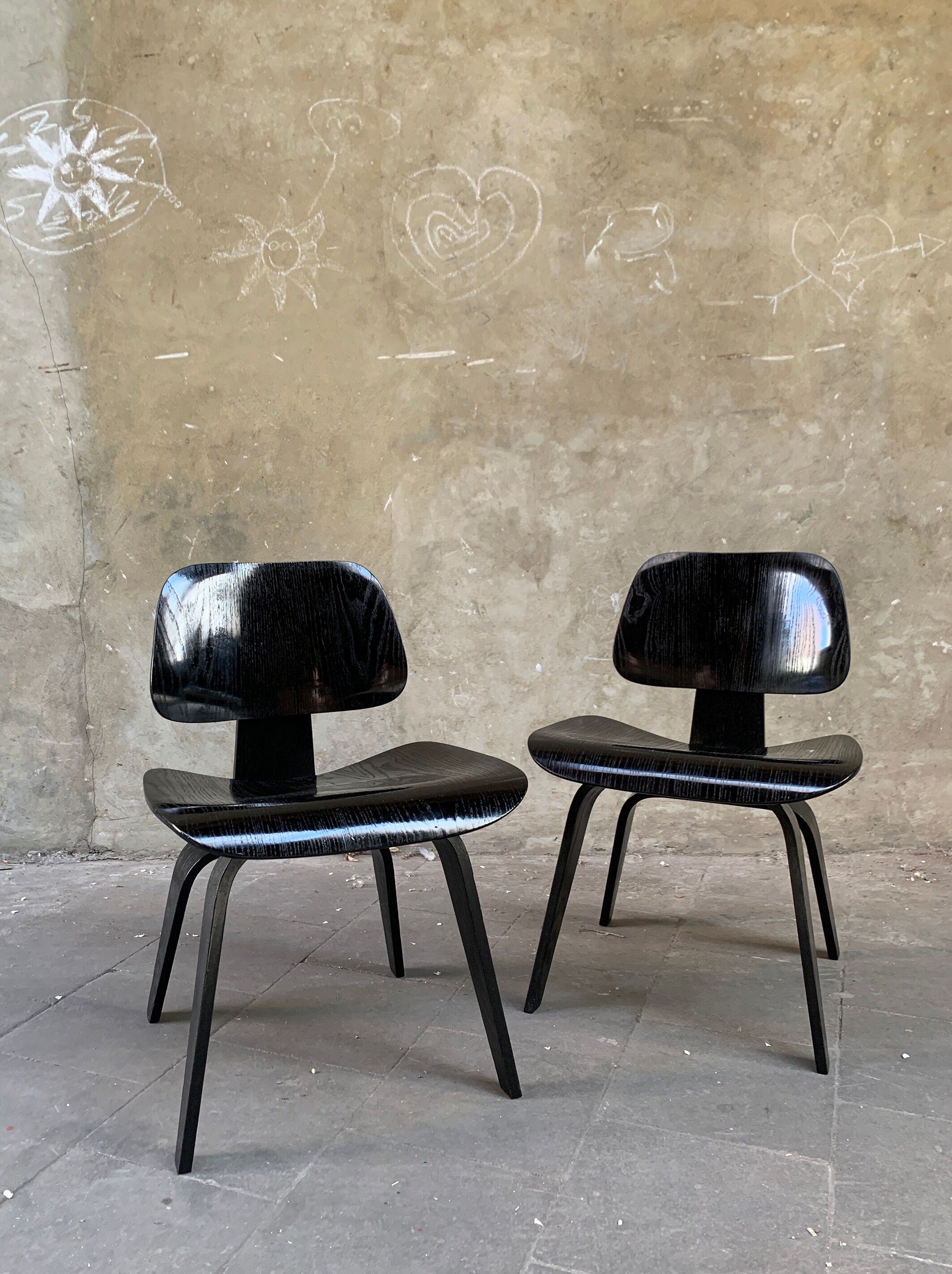Pair of DCW chairs by Charles & Ray Eames in Black for Herman Miller 1950