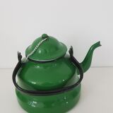 Old green kettle in enamelled metal