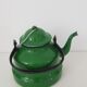 Old green kettle in enamelled metal