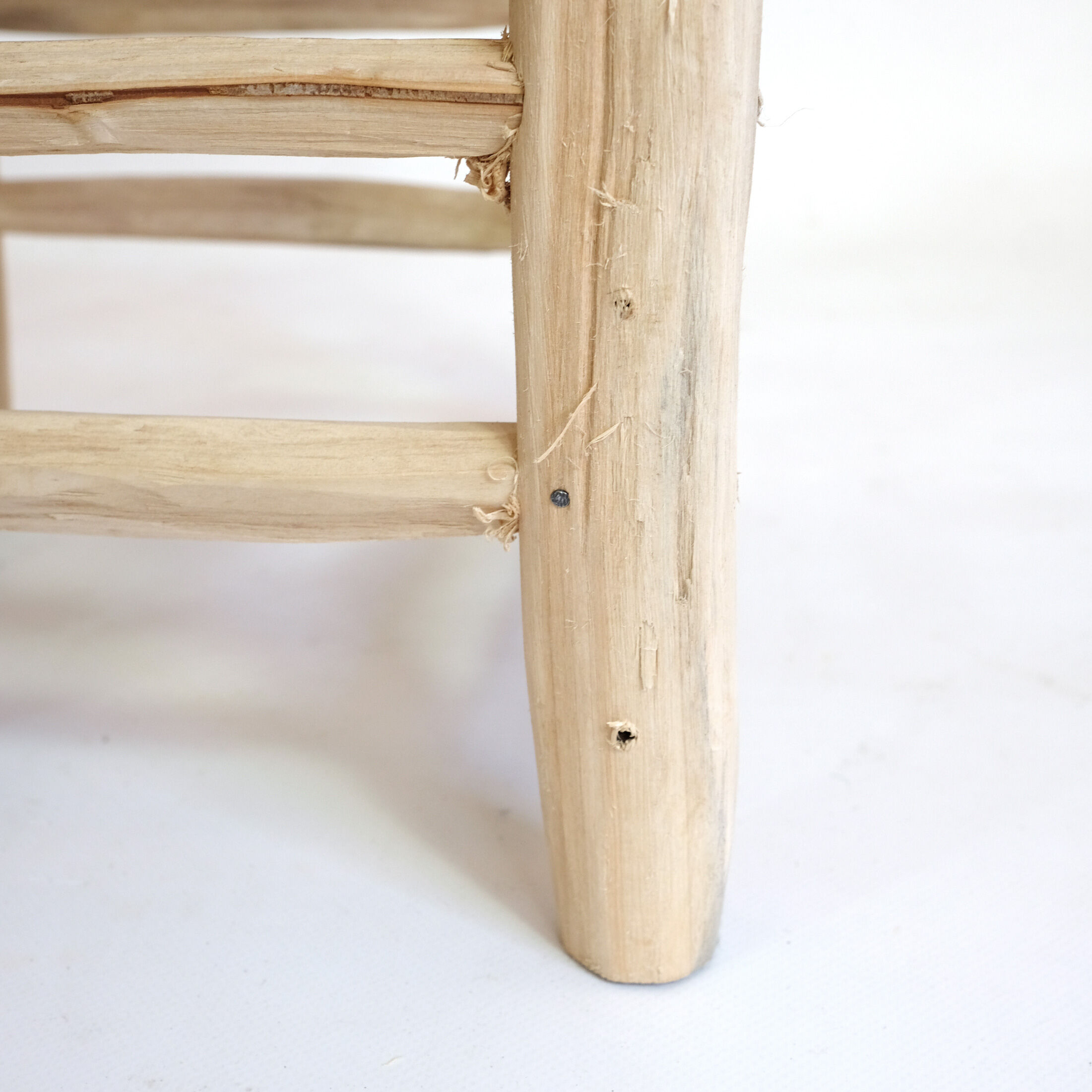 Minimalist stool made of wood and rope