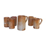 Decanter and enamelled stoneware mugs