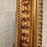 Mirror in wood and gilded stucco