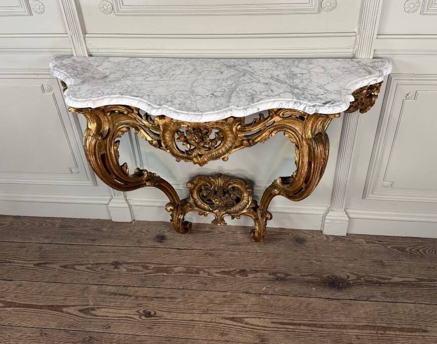 Louis XV style console in carved and gilded wood, circa 1880.