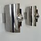 Pair of vintage wall lights, curved chrome metal, France, 1970.