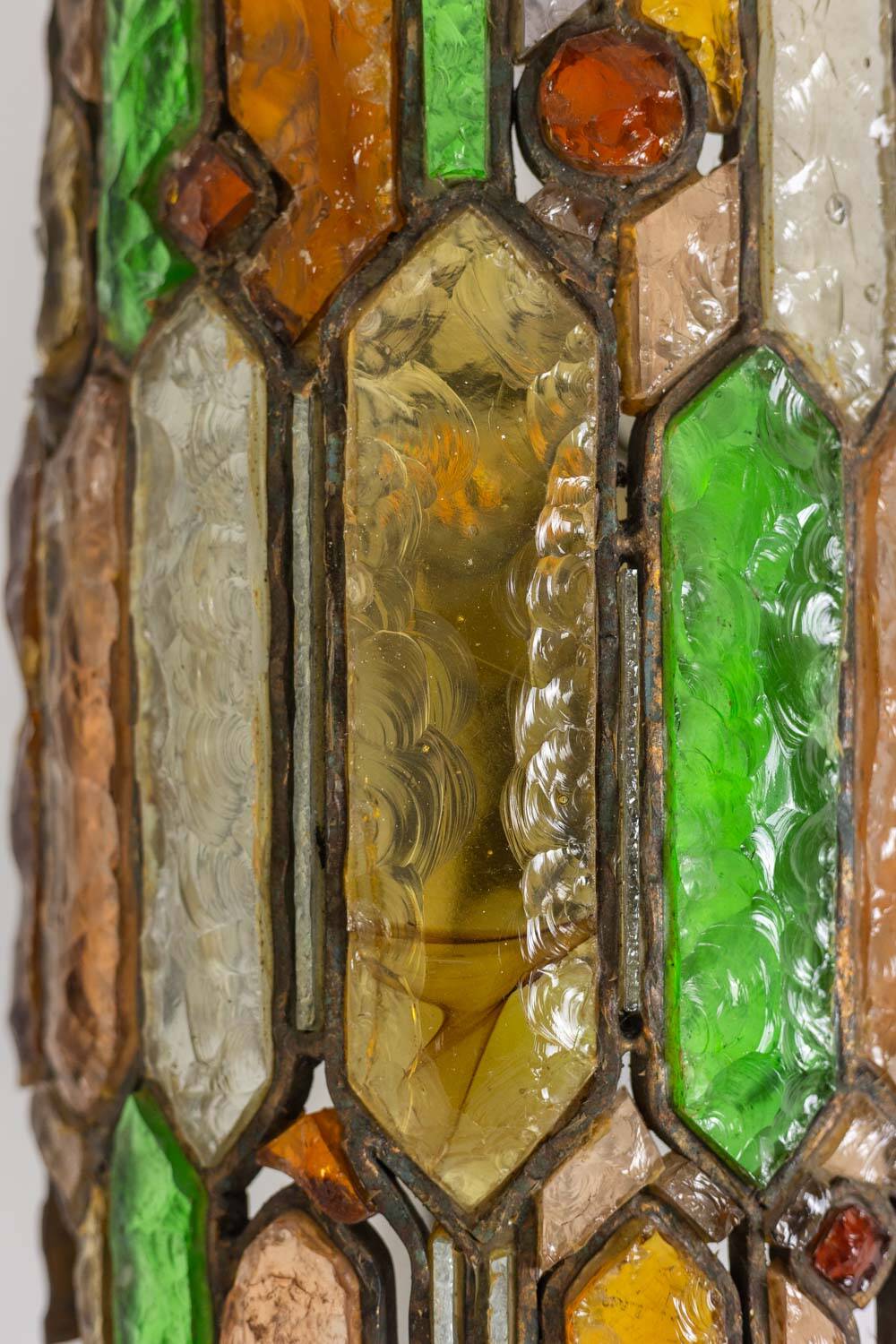 Wrought iron and colored glass wall light. 1960s.