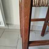 Antique campaign stool in solid wood with a straw seat.