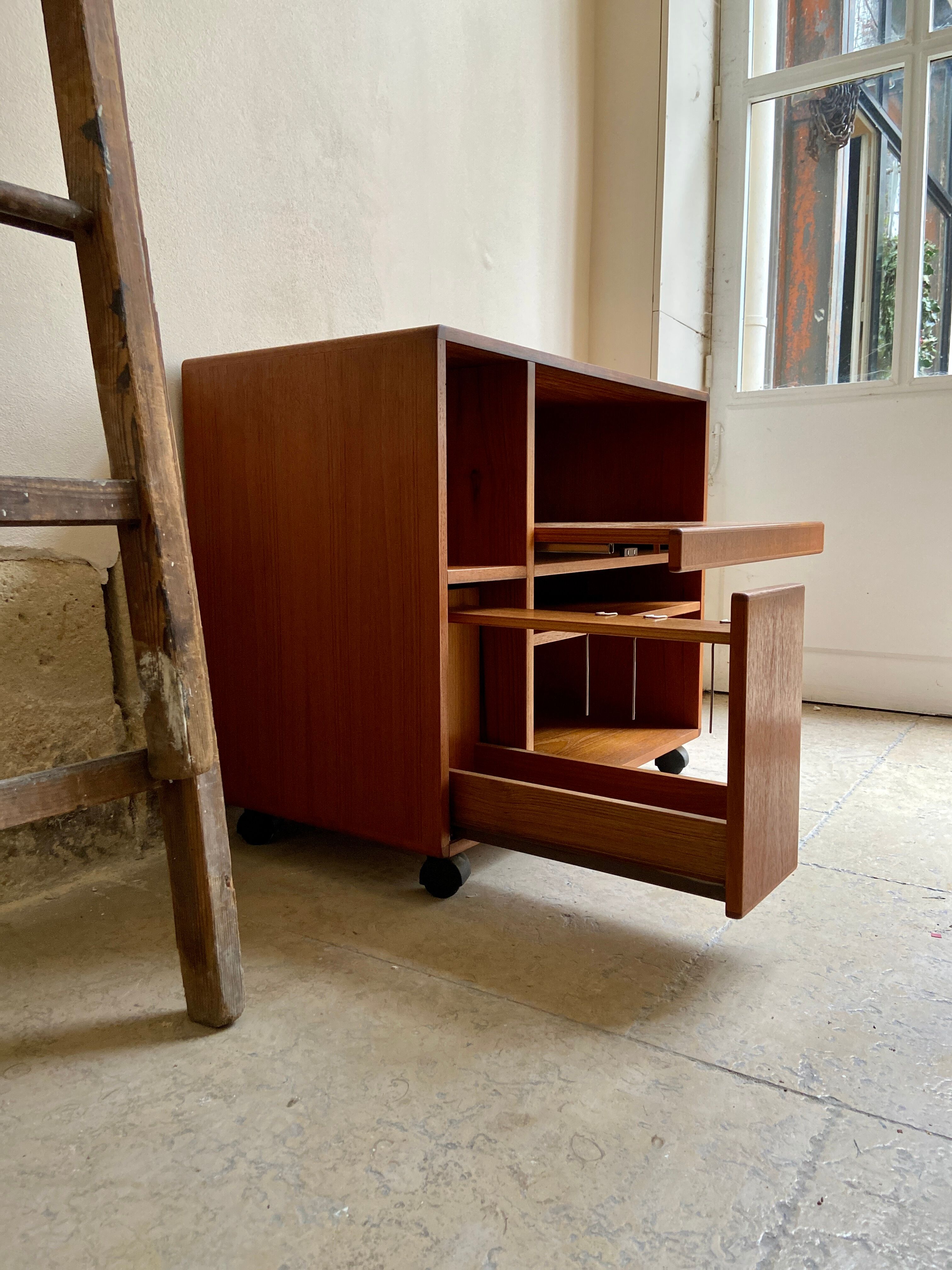 Danish storage cabinet Komfort on teak and rosewood wheels