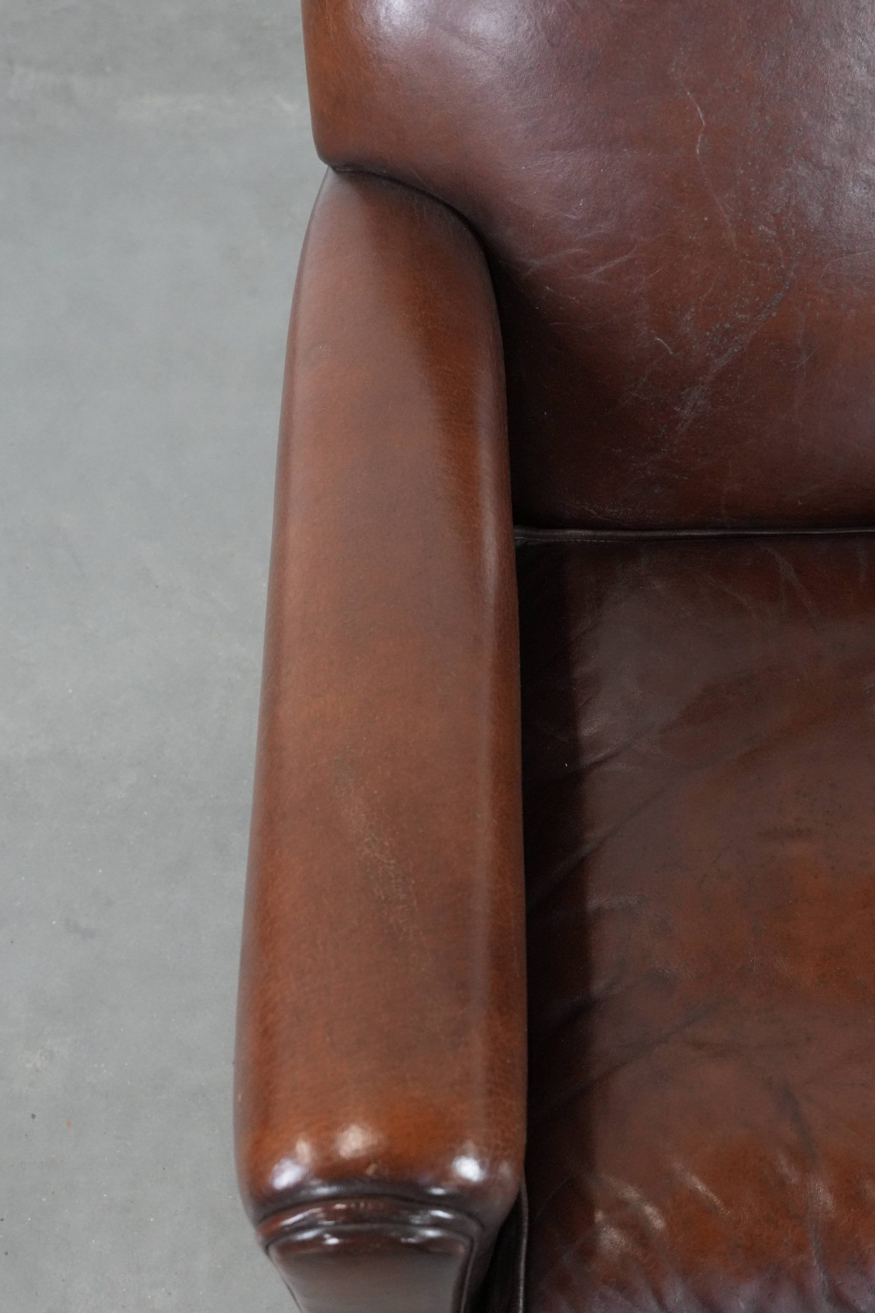 Armchair made of sheepskin leather in art deco design with warm colours