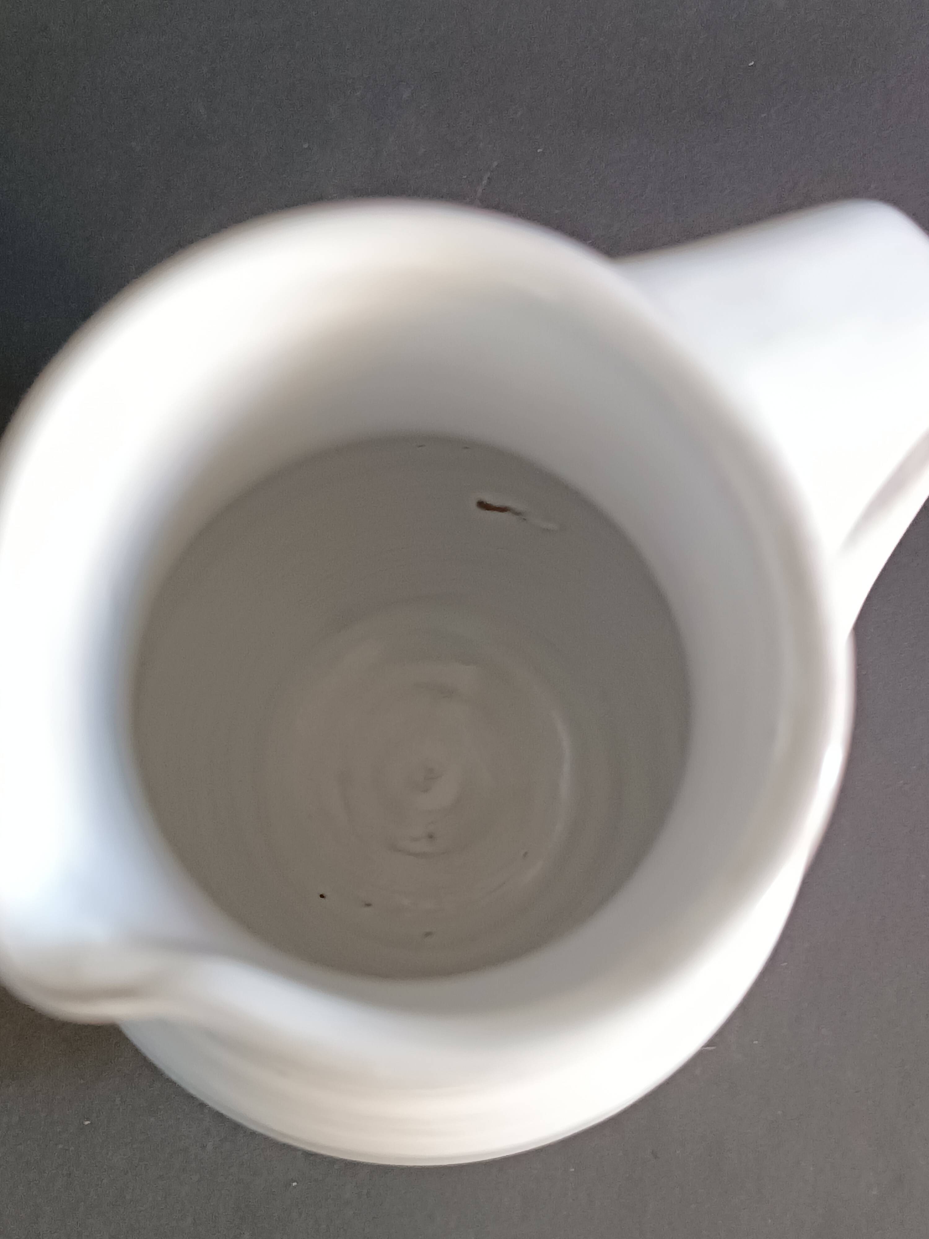 Vintage white glazed ceramic pitcher signed