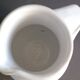 Vintage white glazed ceramic pitcher signed