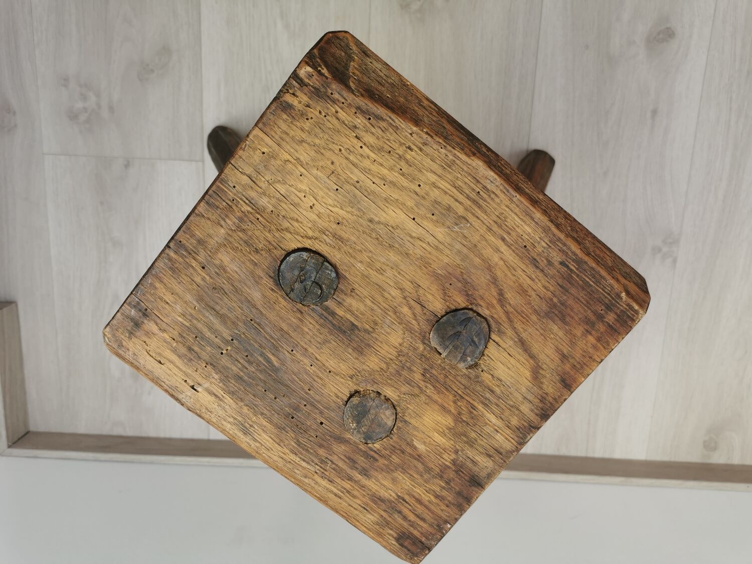 Old wooden stool tripods