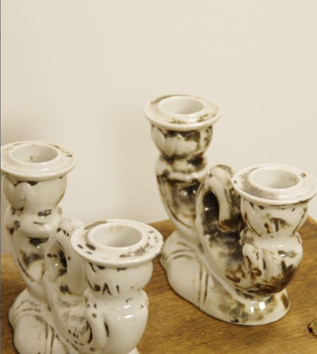 Set of two antique porcelain candle holders