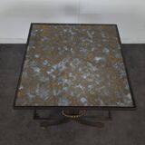 Neoclassical side table in wrought iron and eglomisé glass.