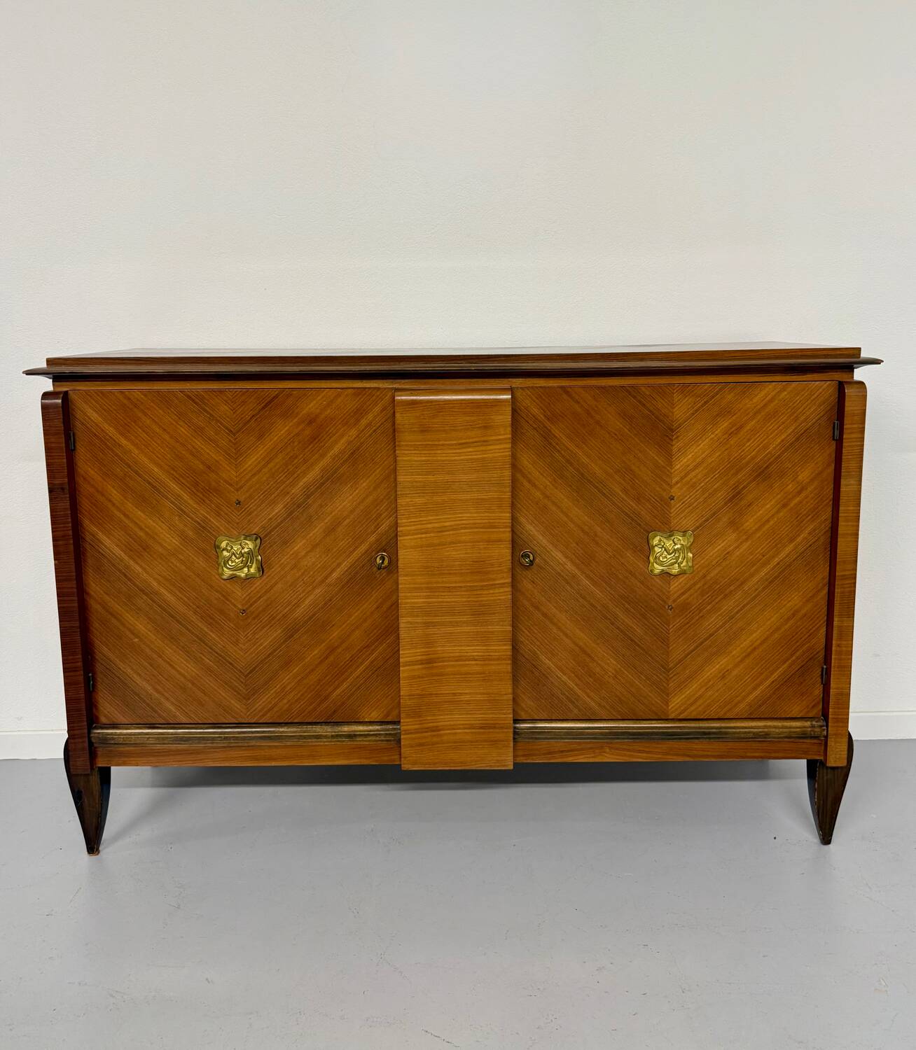 Antique art deco sideboard from the 1930s with veneered wood and bronze insert