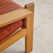 Brutalist armchair in oak and leather by Tage Poulsen, Denmark, 1970s.