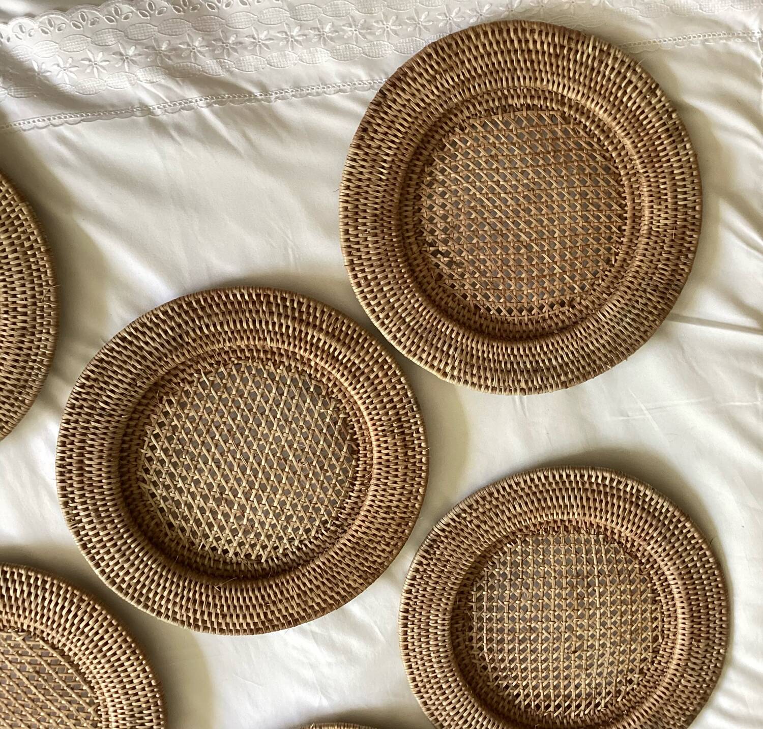 Set of round woven rattan and canework coasters