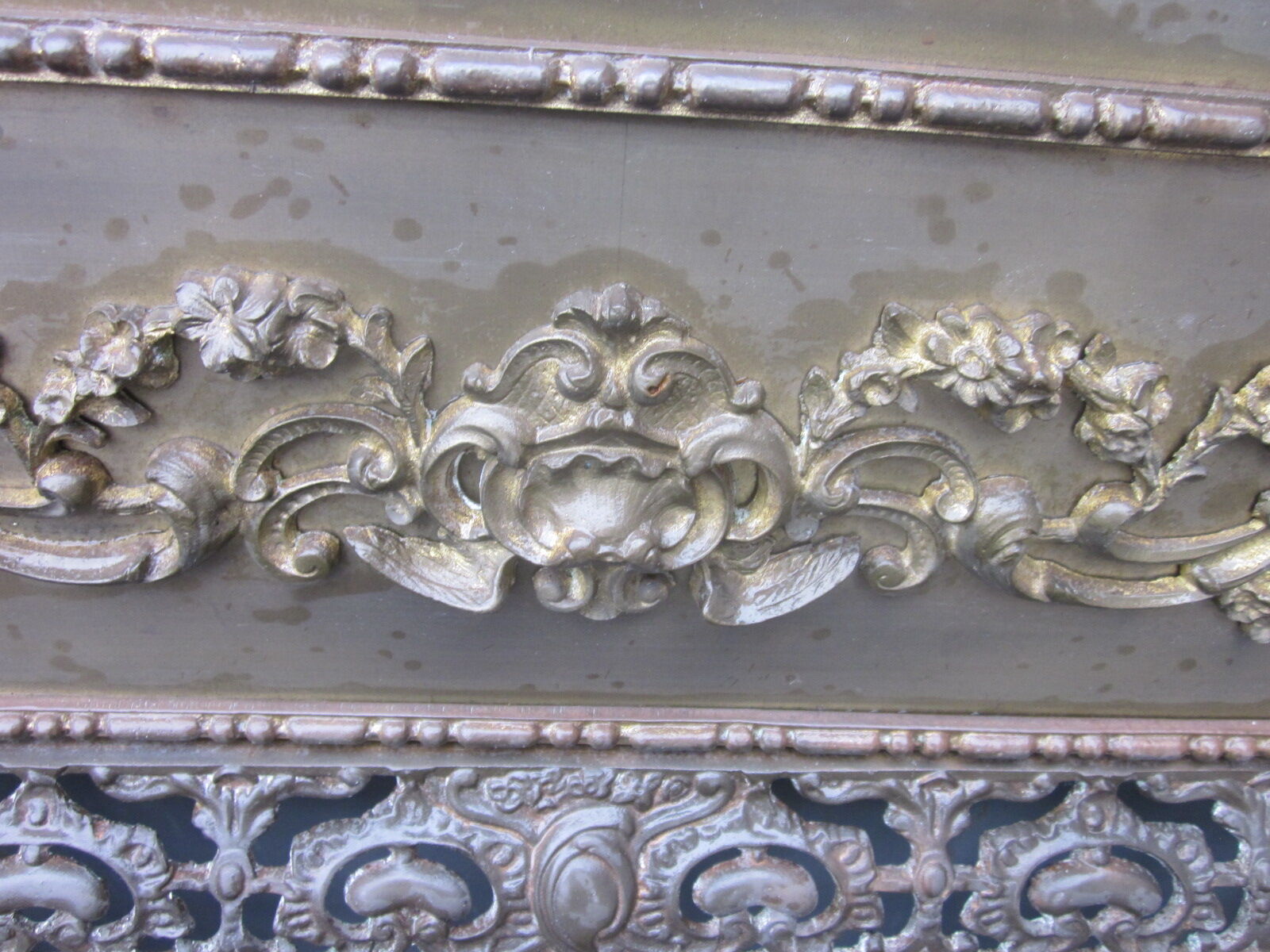 Front of the old fireplace all in bronze